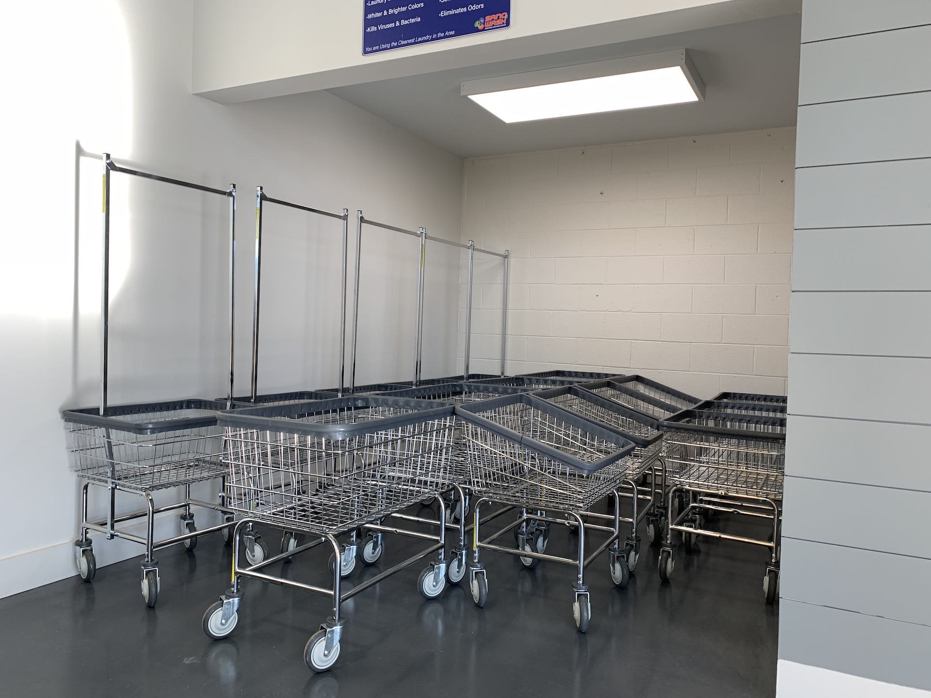 Nested laundry carts ready for customers at Oz Laundry