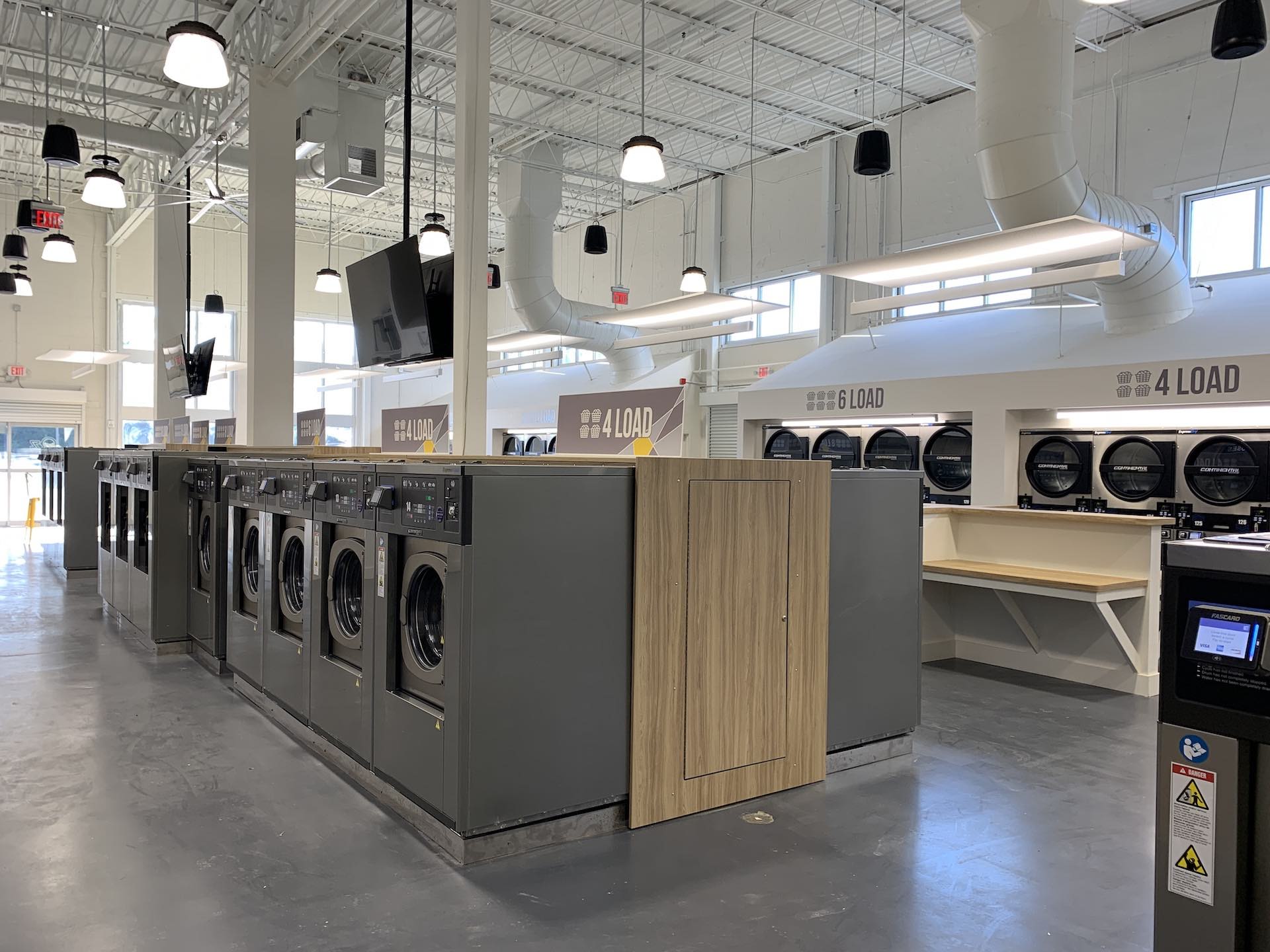 Aisle of washers and dryers at Oz Laundry in Decatur
